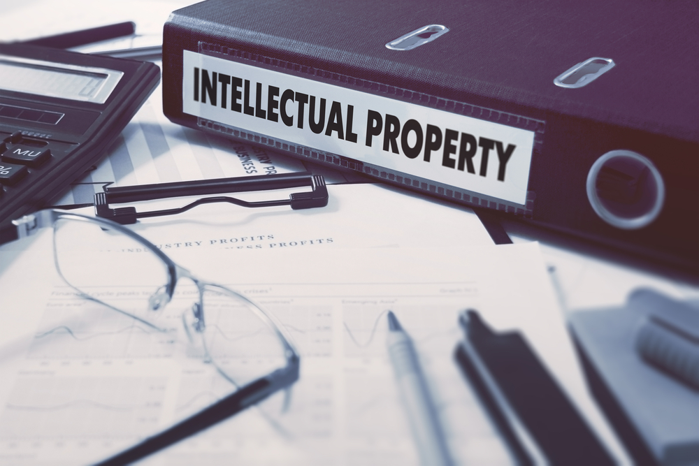 A binder labeled "intellectual property" to illustrate our blog post on the real cost of IP theft.